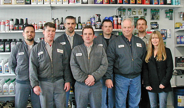 Dennis Musga's crew at the Model Garage, 2006.  L-r, (back) Steve Horiuchi, Dean Patriquin, Steve Ramsey, Chris Currie, (front) Jeff Divers, Garrett Lindstrom, Dennis and Janice Musga.