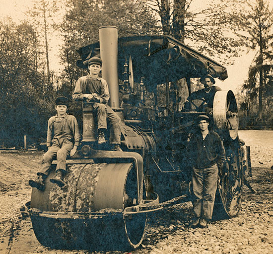 Roadbuilding c1910 Charlie driving, Paul standing, Harry on roller, Ralph sitting above.